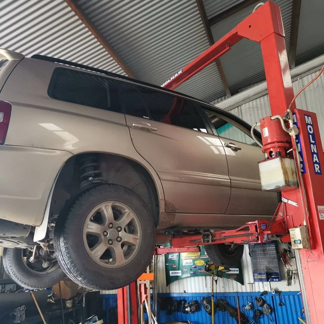 Toyota 4WD wagon up on the hoist for service at S & A Automotive Cairns