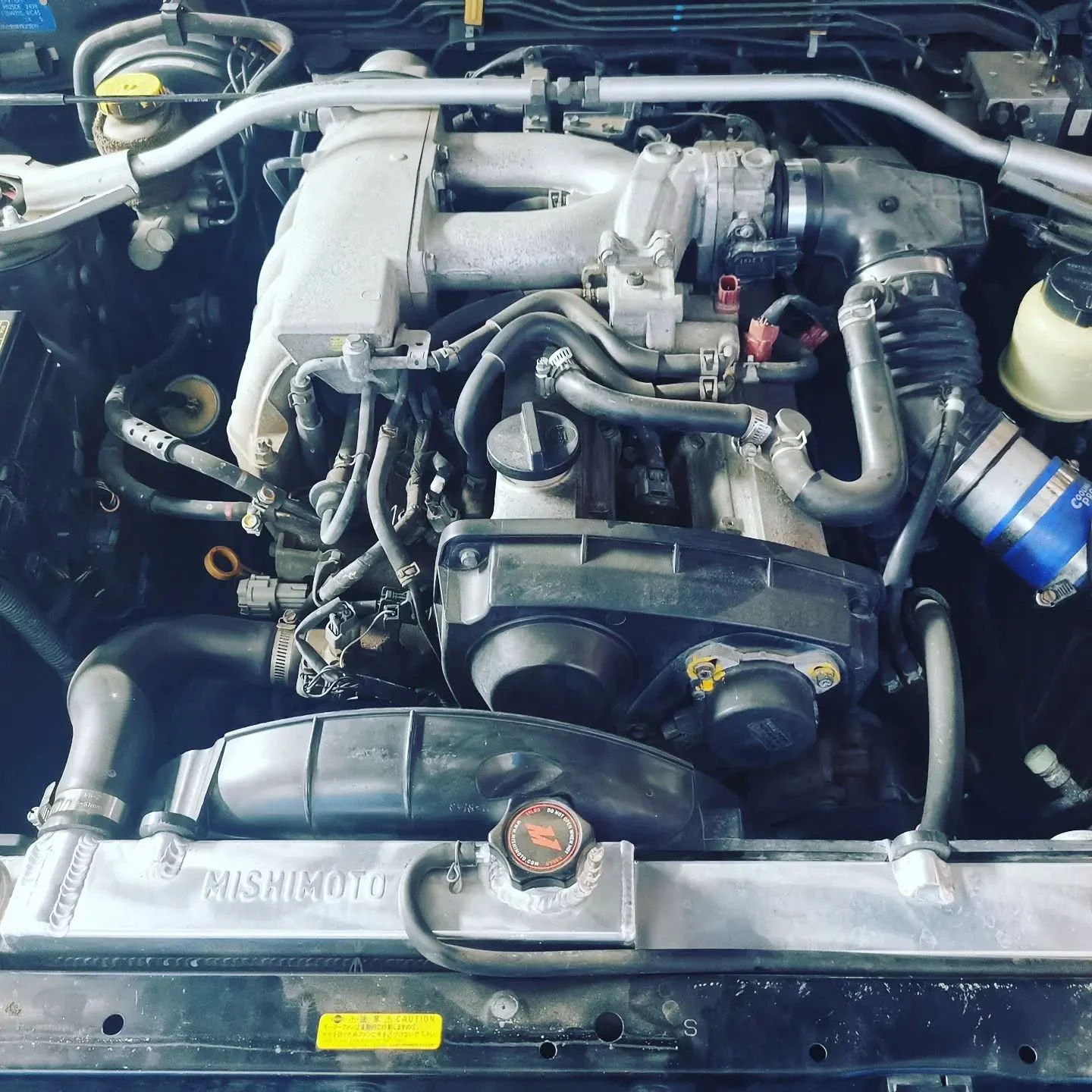 Engine bay inspection during a logbook service at S & A Automotive Cairns