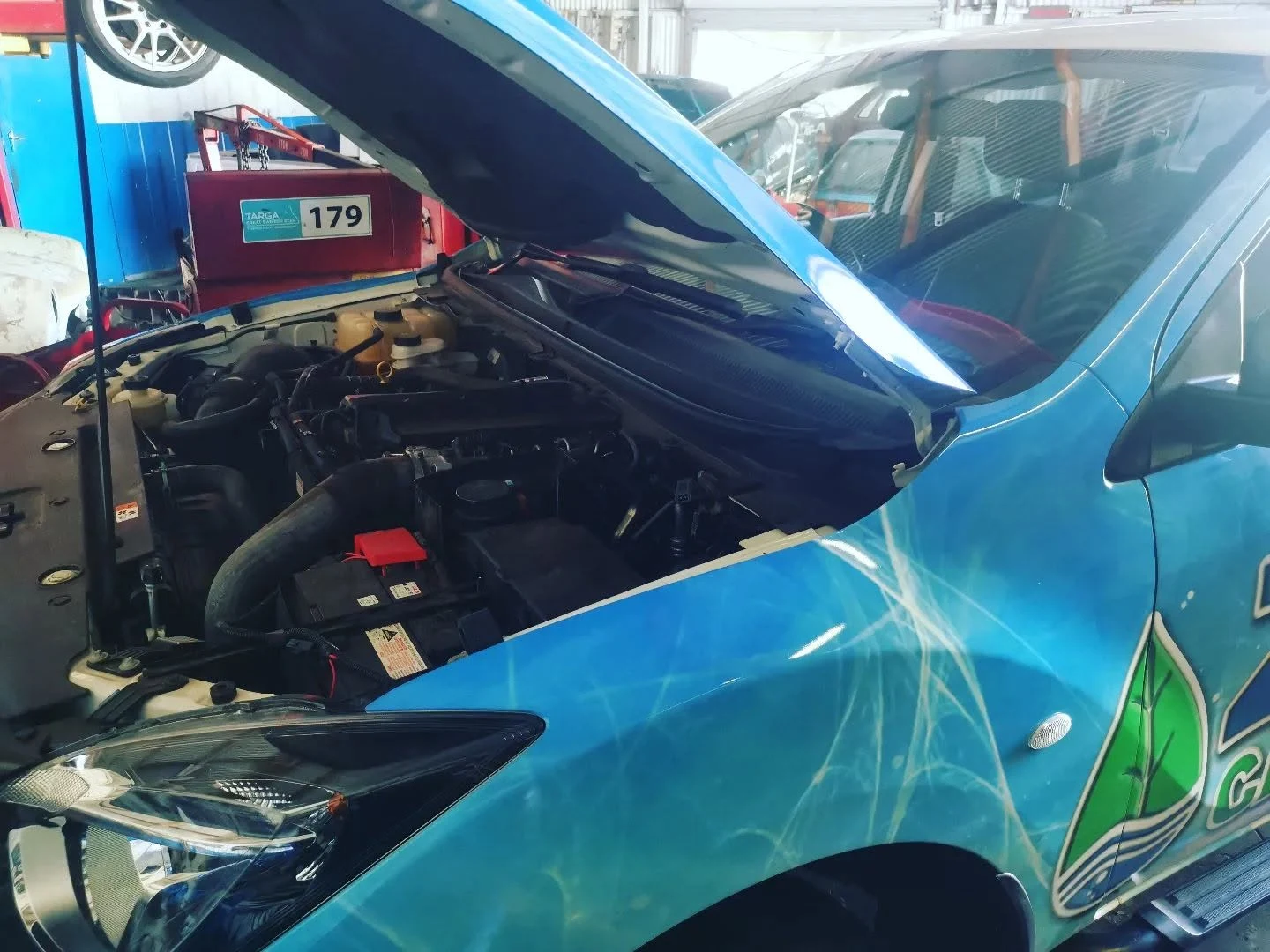 Blue Toyota race car with bonnet up during a logbook service at S & A Automotive Cairns