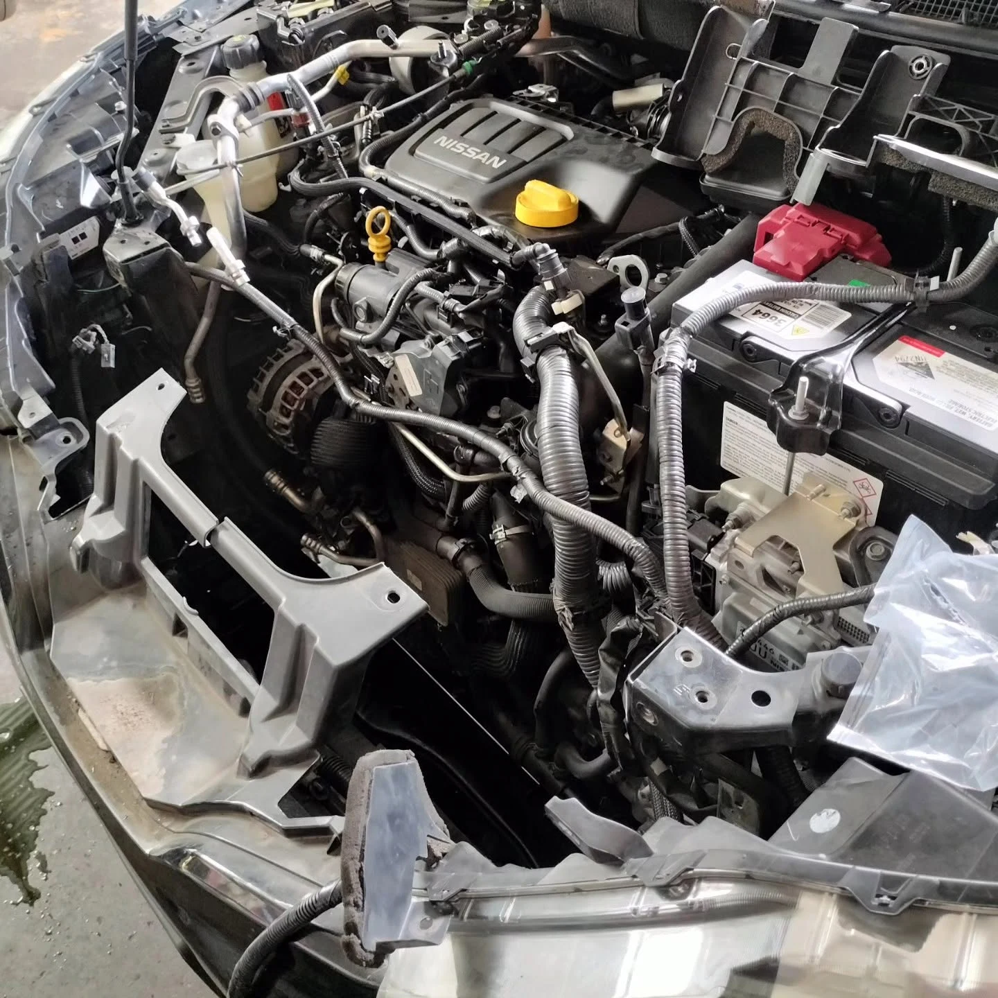 Nissan engine bay with front end stripped for mechanical repairs at S & A Automotive Cairns